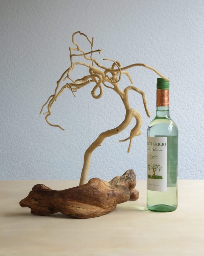 IMG_7132 (1) Handcrafted wooden sculpture of Ivy on a driftwood base.
