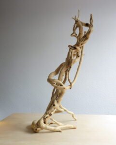 One-of-a-kind, free standing Ivy wood sculpture that will hold a lantern. Handcrafted and finished naturally.