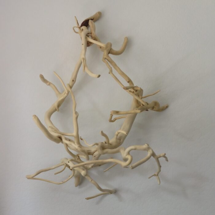 A unique and versatile wooden sculpture that can be free standing or hung.
