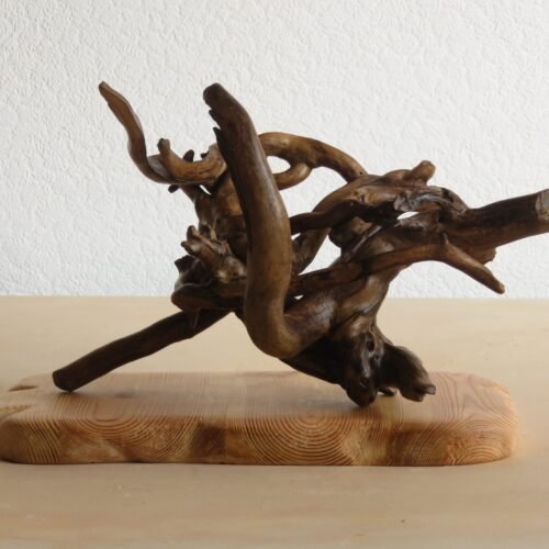 A free standing Handcrafted and unique Ivy wood sculpture.