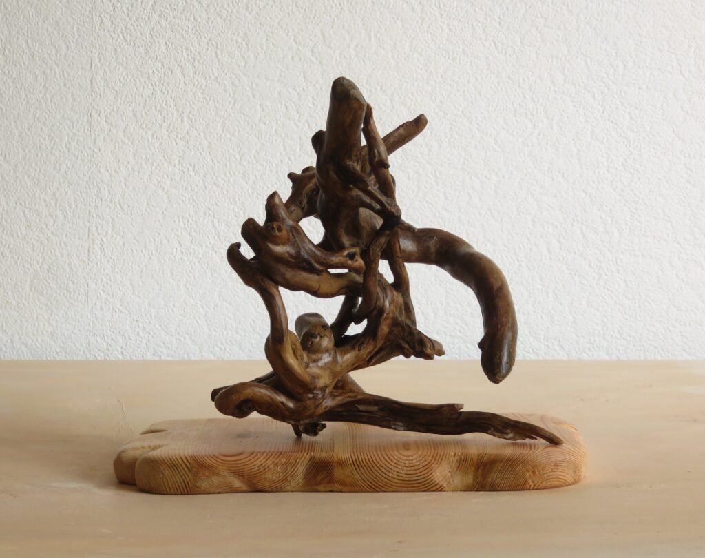 This handcrafted wooden Ivy sculpture can be rotated to different positions to suit you.