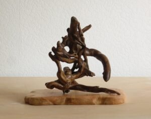 This handcrafted wooden Ivy sculpture can be rotated to different positions to suit you.