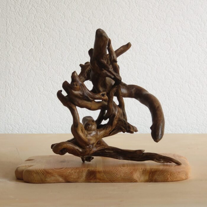 Free standing Ivy with plinth This handcrafted wooden Ivy sculpture can be rotated to different positions to suit you.