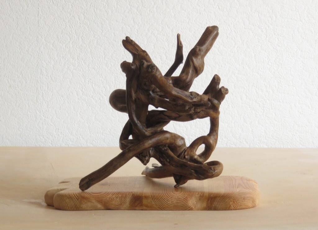 Ivy sculpture, free standing and multi positional. Handcrafted, burnished and polished to bring out its unique colouration and shape.