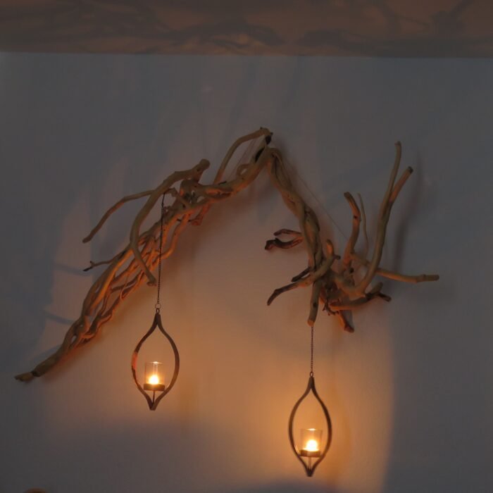 Wall hanging with lanterns A unique wooden sculpture that comes to life with movement in candlelight.