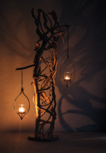 Handcrafted natural wood sculpture designed to hold lanterns for that special ambience.